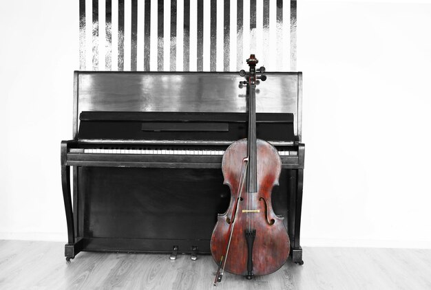 Photo cello near piano indoors