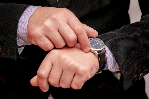 Cellphone in the hands of a businessman. Man with smartphone in office