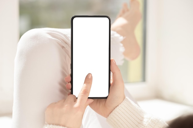 Cellphone mockup woman user customer hold cellphone mockup with white screen in hand Use mobile shopping app check social media news texting mobile sms order food delivery