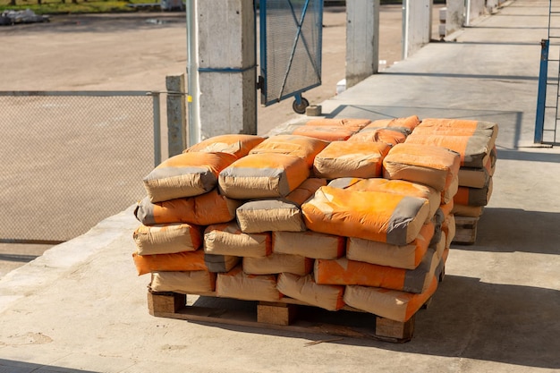 Cement bags are placed on pallets and stored in warehouses