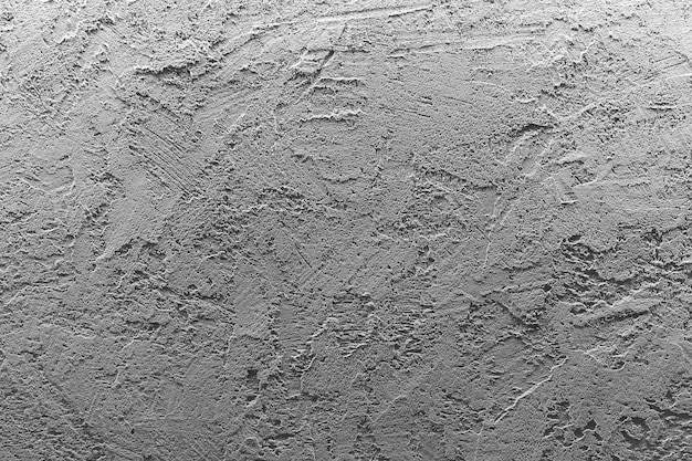 Cement concrete wall background Gray stone texture and untreated wall surface before finishing High quality photo