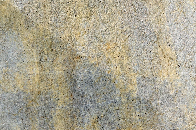 Cement muur textuur vuile en verkleurde ruwe grunge achtergrond