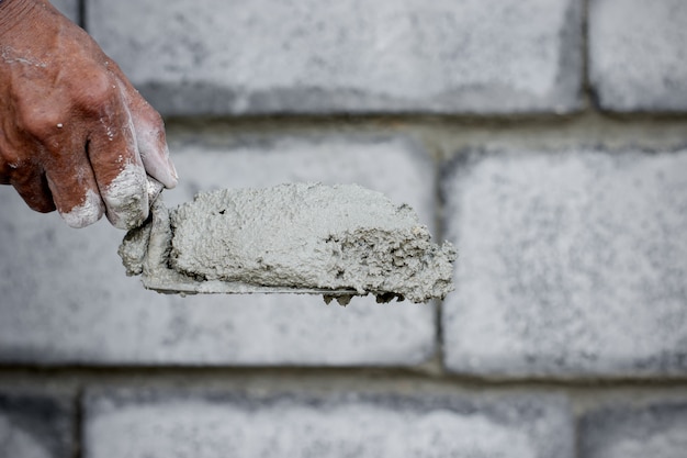 Photo the cement technician is creating the wall.