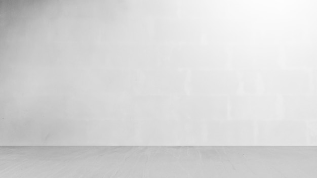 Cement wall with floor in the empty room and light for background.