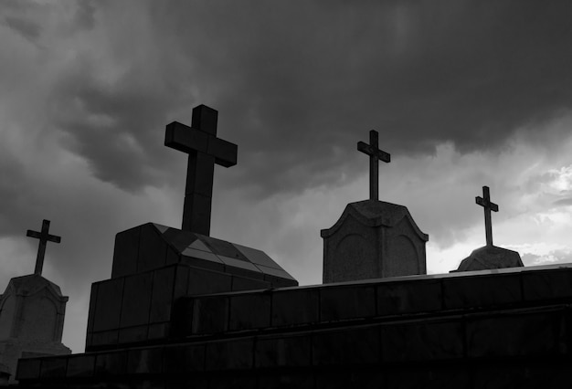 cemetery or graveyard at night in black and white