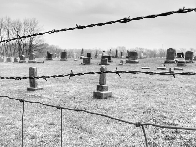 Photo cemetery through barbed wire