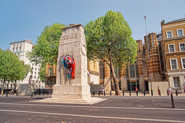 Cenotaph war memorial on Whitehall in London in the UK. People on the background.