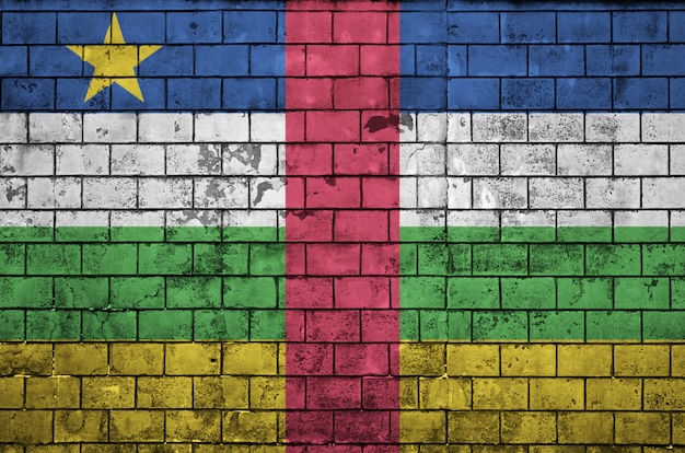 Central African Republic flag is painted onto an old brick wall