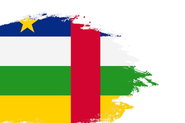 Central African Republic flag on a stained stroke brush painted isolated white background with copy space