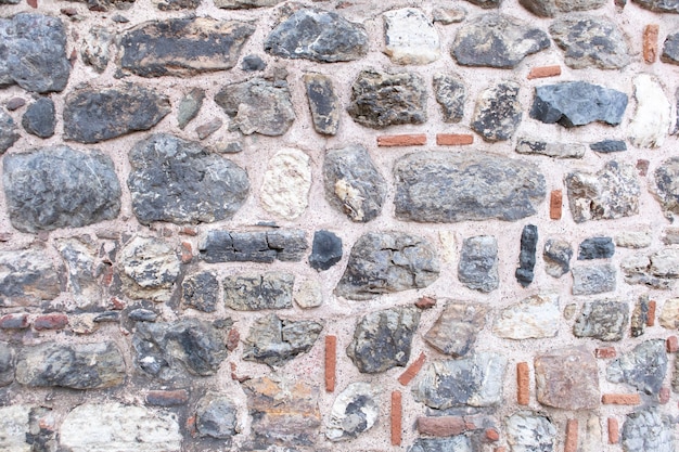 Centuries old ancient stone tower wall background.