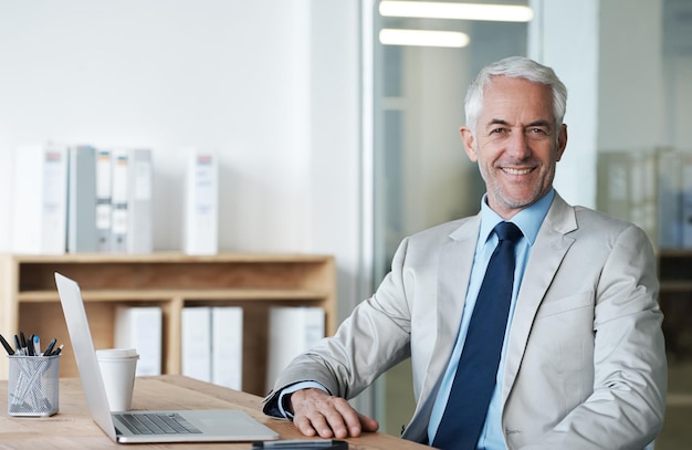 ceo businessman and laptop at desk portrait and work for lawyer firm senior executive office and smile at company suit and success in corporate workspace for attorney and insurance lawyers