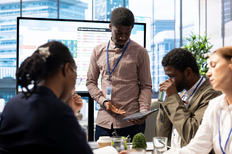 Photo ceo and investors group reviewing financial reports during briefing conference