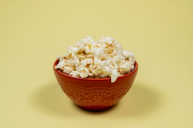 A ceramic bowl of salted popcorn