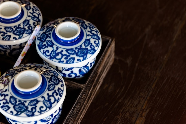 Photo ceramic bowl set on wooden tray