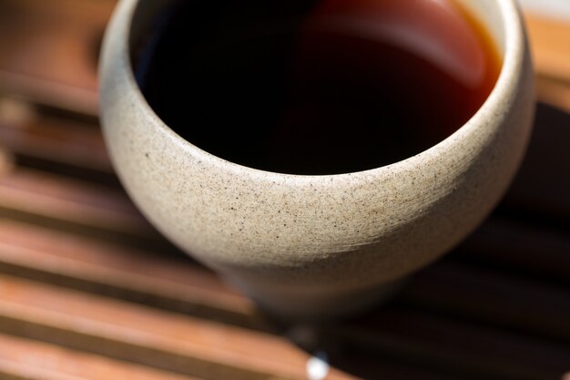 Ceramic bowls made of clay on a wooden background.