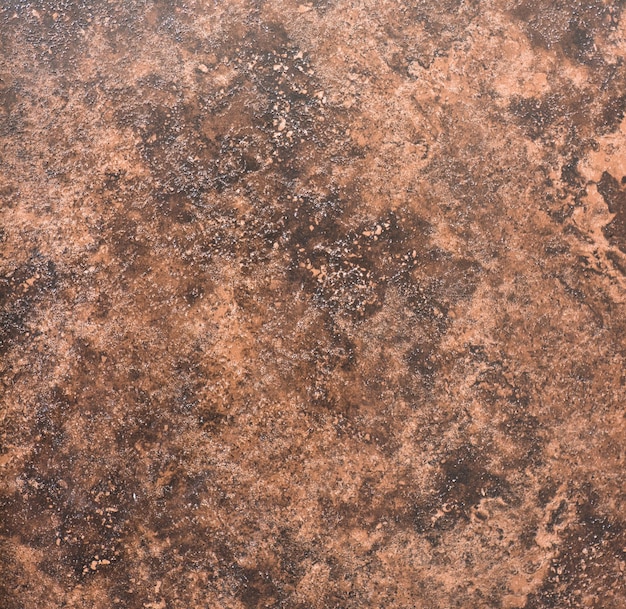 ceramic brown tile with rough abstract stone surface pattern