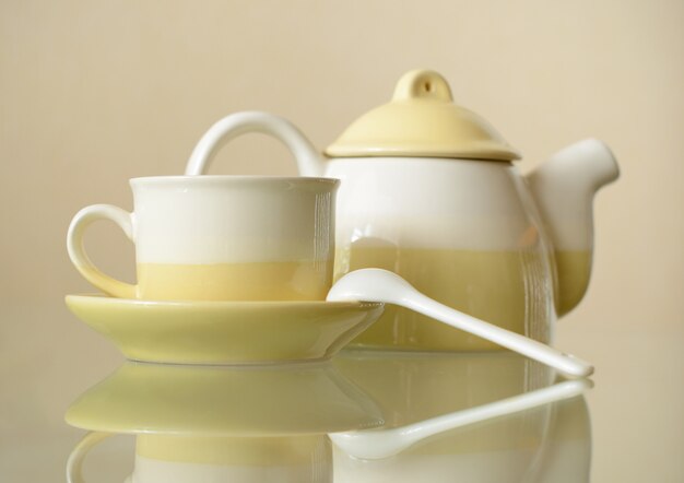 Ceramic coffee set on beige background