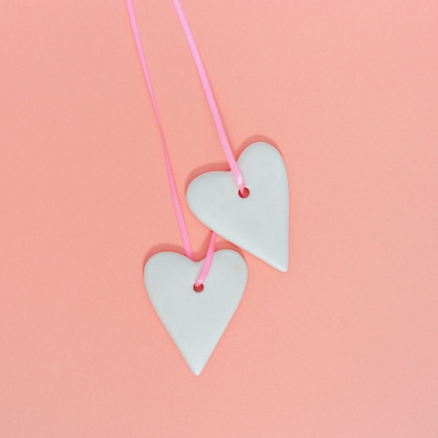 Ceramic hearts on a pink background