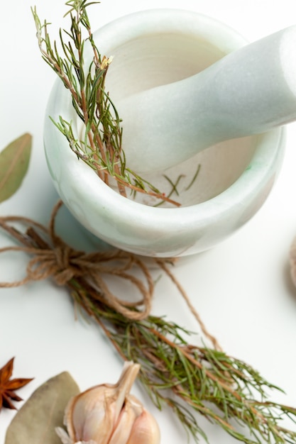 Ceramic Mortar with Pestle and fresh spices 