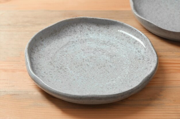 Premium Photo | Ceramic plate on wooden background
