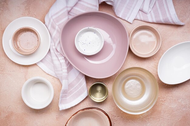 Ceramic tableware on beige background Top view