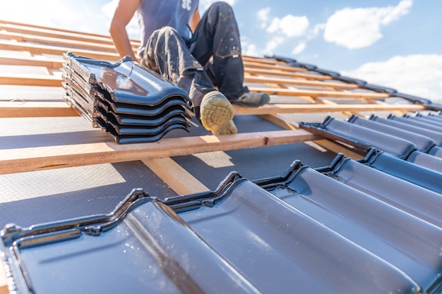 Ceramic tile on a wooden frame of new roof