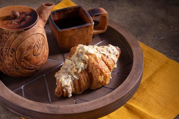 Ceramic vintage tea utensils teapot and tea mug Breakfast or dinner in rustic style serving with a wooden tray