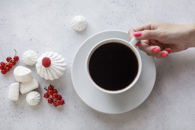 Ceramic white cup with hot coffee