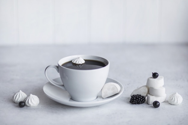 Ceramic white cup with hot coffee