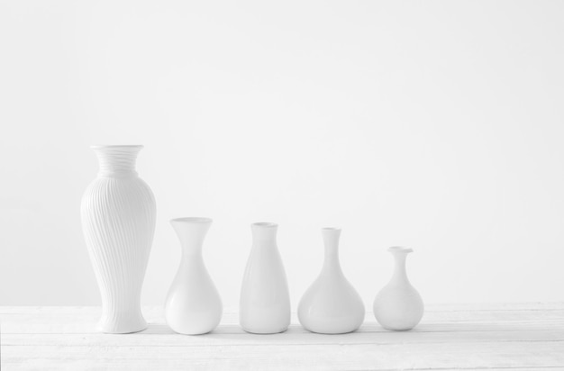 Ceramic white vases on white background