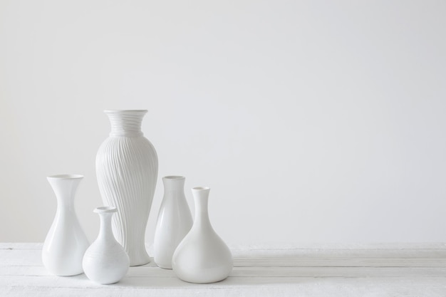 Ceramic white vases on white background