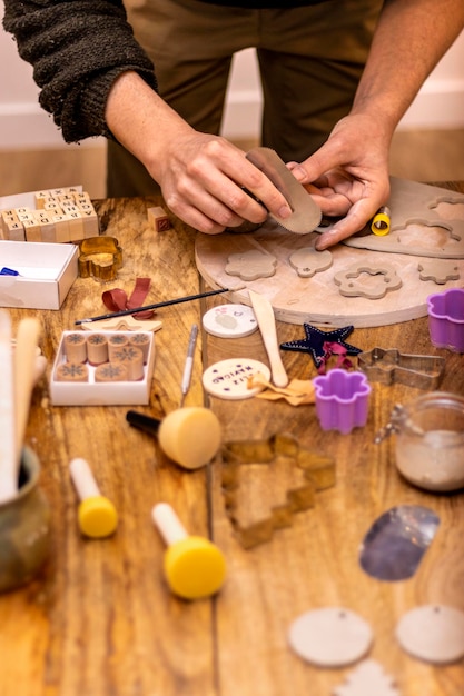 Ceramics workshop Master craftsman works with sandpaper