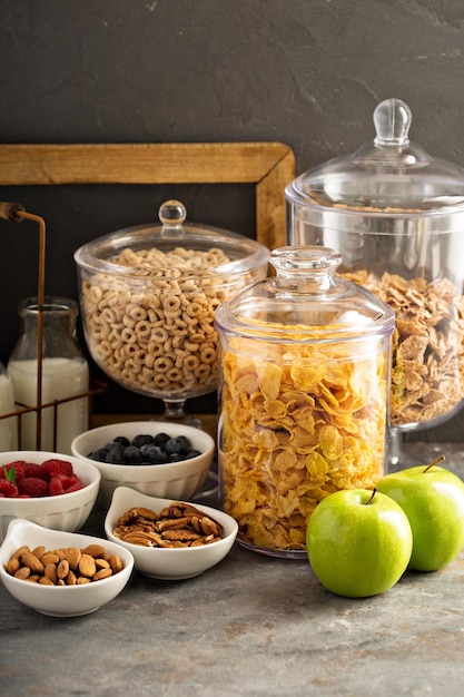 Cereal bar or buffet wih cornflakes fruit and nuts