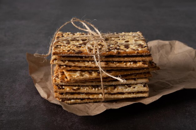 Cereal bread with flax sesame and sunflower seeds on craft paper on