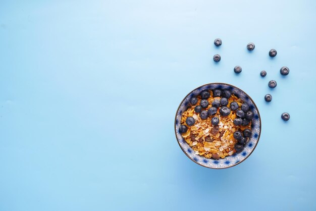 Photo cereal breakfast and blue berry in bowl on table