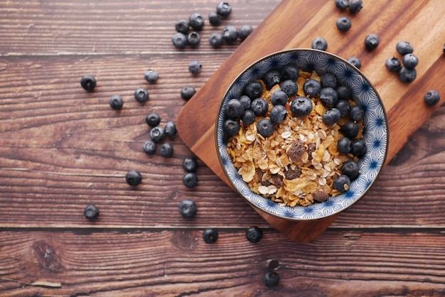 cereal breakfast and blue berry in bowl on table