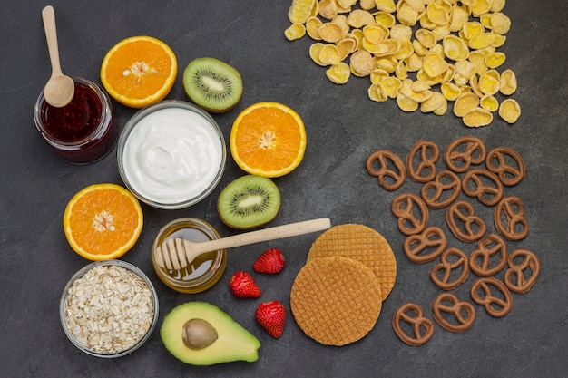 Cereal cookies juice, fruit jam cookies, strawberries, kiwi honey, orange juice.