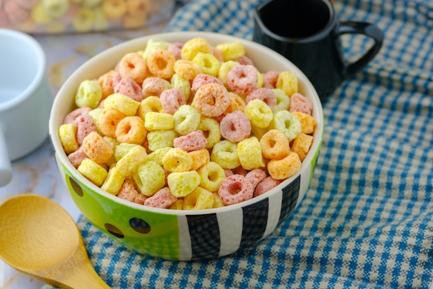 Cereal flakes in bowl with copy space,Breakfast concept.Food with delicious fruity taste and fruity colours. It's made with maize,wheat,and barley