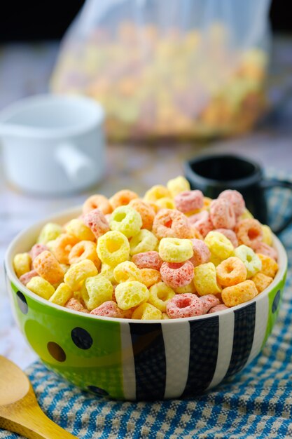 Cereal flakes in bowl with copy space,Breakfast concept.Food with delicious fruity taste and fruity colours.It's made with maize,wheat,and barley