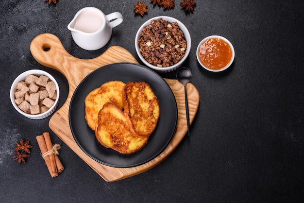 Cereal with chocolate milk and bread in an egg against a dark concrete background