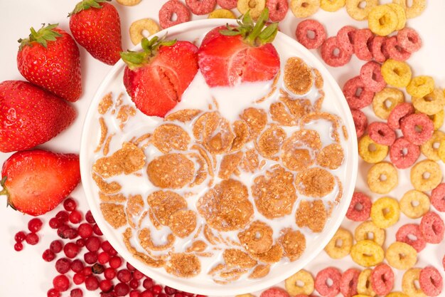 Cereals drenched in milk quick breakfast with fruits and berries