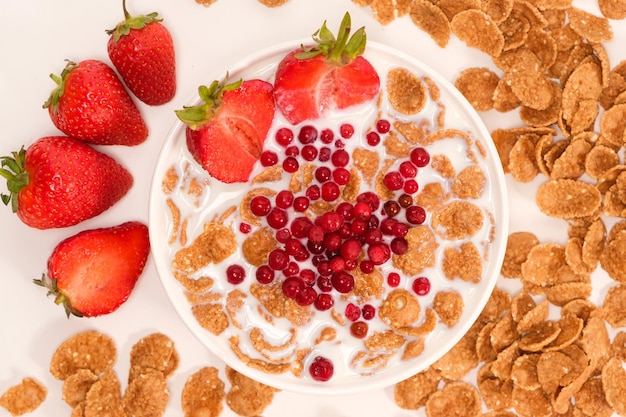 Cereals drenched in milk quick breakfast with fruits and berries