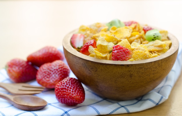 Cereals with fruit in wooden bowl 