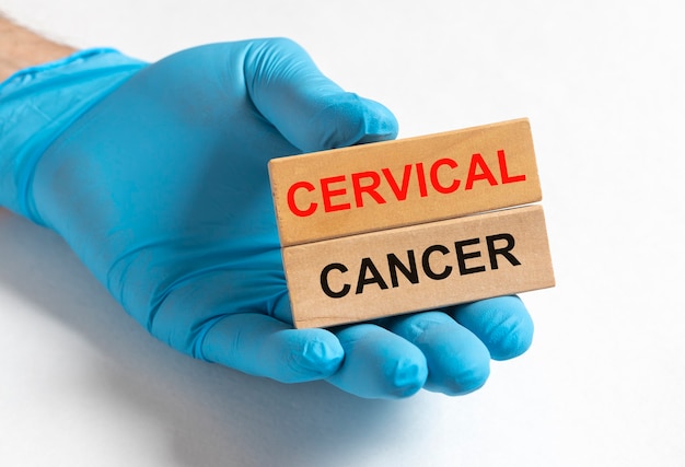 Cervical cancer disease inscription on paper in doctor hands in gloves, female oncology.