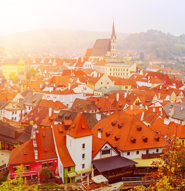 Cesky Krumlov a famous czech historical beautiful town from above travel background with red roofs and chapel