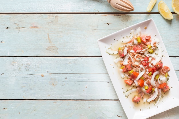 Ceviche with salmon, tomato, onion, lemon