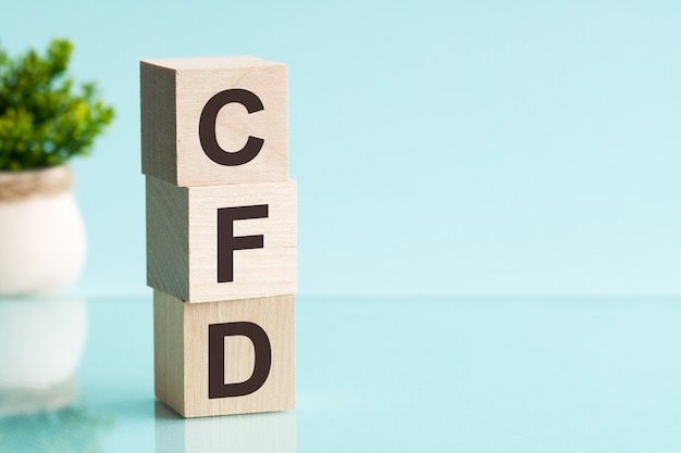 CFD abbreviation - Contract For Difference, on wooden cubes on a light surface