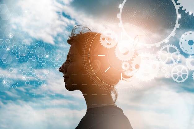 Photo cg of female profile silhouette, gears, and blue sky