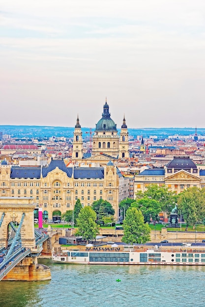 Chain Bridge over Danube River and Saint Stephen Basilica at Pest city center in Budapest, Hungary