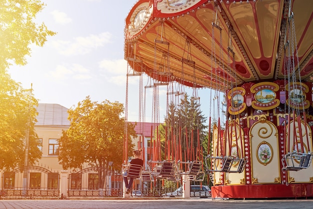 Chain carousel merry-go-round in amusement park